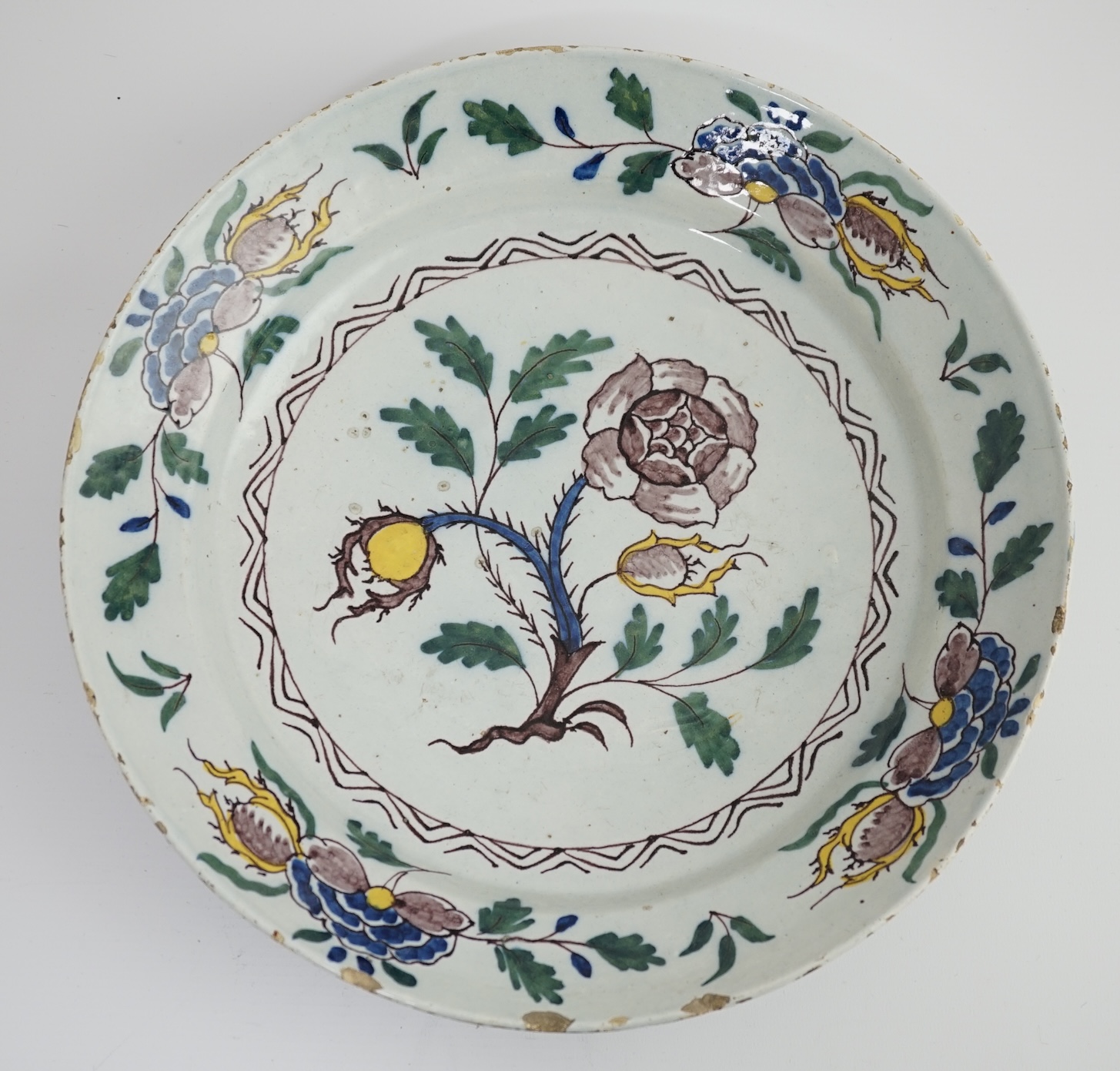 A mid 18th century English polychrome delftware dish